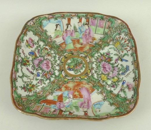 A Canton porcelain dish, late 19th century, of fluted, square form reserve decorated with panels