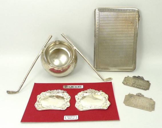 A silver cigarette case with engine turned decoration, Birmingham 1916, an ashtray modelled as a