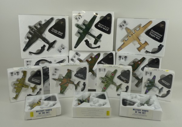A quantity of Military Giants of the Sky model aeroplanes, together with booklets and enamel badges.