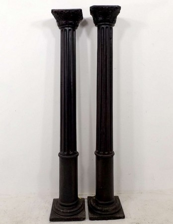 A near pair of late 20th century stained hardwood, semi fluted columns, of composite form, 32 by