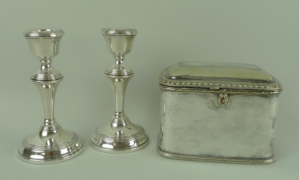 A pair of loaded silver candlesticks with turned decoration, Birmingham 1955, 11.47toz total weight,