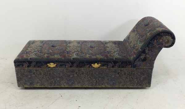 A 20th century chaise longue cum ottoman, hinged and opening on either side, upholstered in