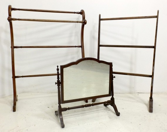A Victorian towel rail of turned mahogany, 71 by 30 by 94cm high, a further beech towel rail, and