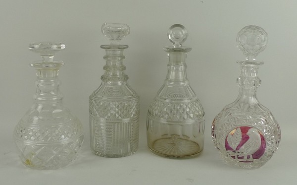 A Georgian cut glass three ringer decanter and stopper, further decanter with bull's eye stopper,