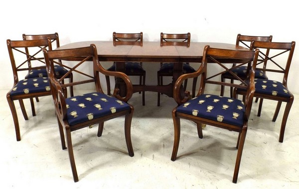 A Georgian style reproduction burr walnut veneered and crossbanded, extending D end dining table,