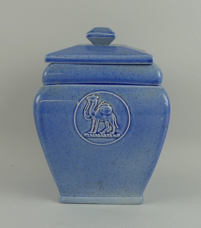 An Ashtead pottery tea caddy and cover, early 20th century, of square section moulded with the crest