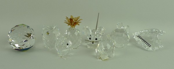 A group of eight Swarovski crystal ornaments comprising an owl, teapot, piano, squirrel, mouse,