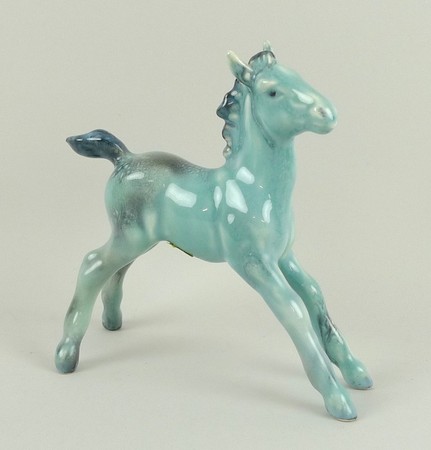 A Beswick blue glazed 'Large stretched foal', model number 836, first version, 13 by 13cm. 
Note: