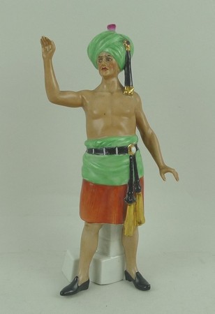 A Goebel Werner porcelain figure of an Indian wallah, circa 1930s, modelled standing, impressed