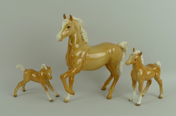 A Beswick figure of a palomino prancing Arab horse, 1st version, no 1261, palomino foal, no 1084,