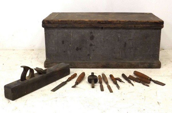 A carpenter's tool chest with chisels, some stamped J Measures, the pine trunk fitted with two