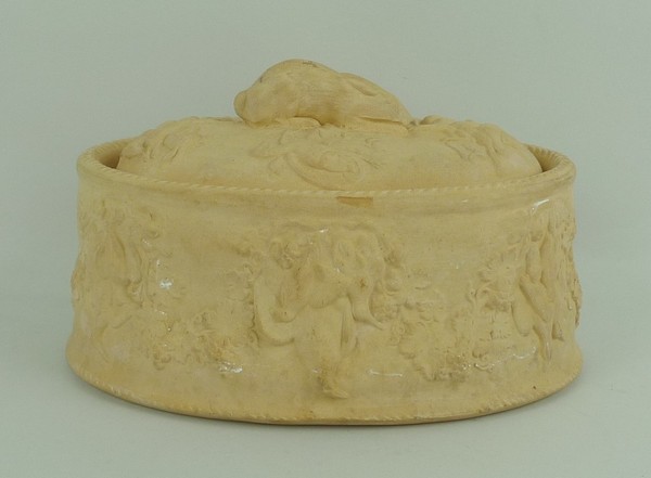 A Wedgwood terracotta game pie dish, late 19th century, moulded with partridge and garlanded with