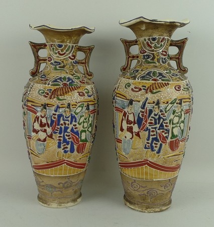 A pair of Japanese pottery vases, Meiji period or later, of twin handled, shouldered ovoid form