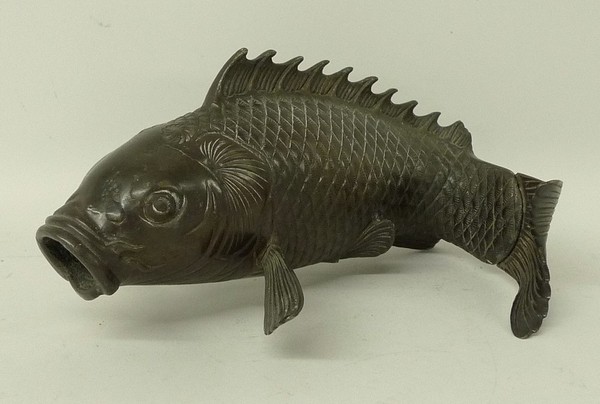 A Meiji period Japanese bronze koi carp, naturalistically carved with scales, unsigned, a/f tail