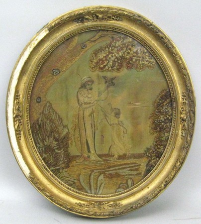 A 19th century embroidery on silk, depicting a young woman and child with a bird, 33 by 29cm.