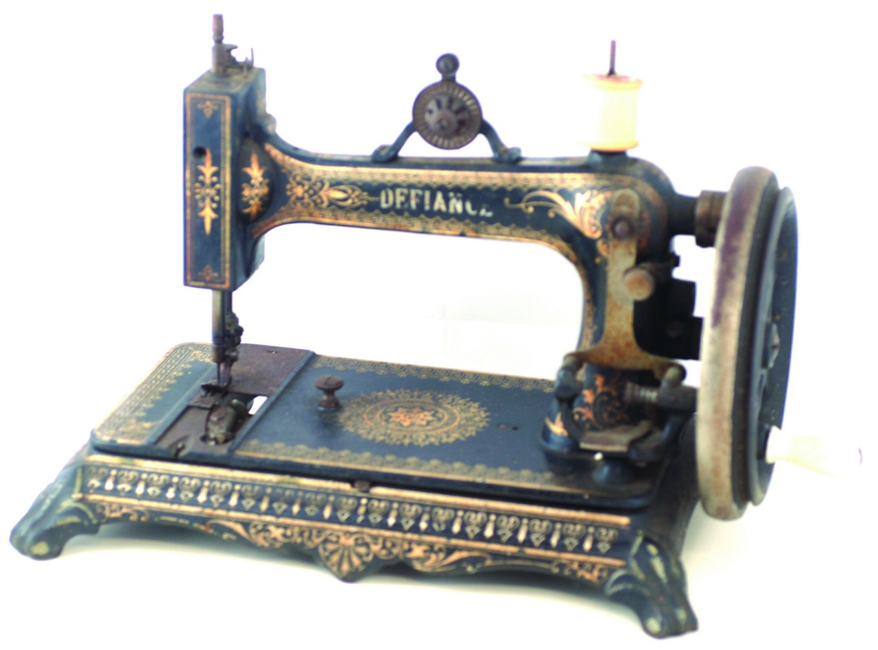 CAST IRON SEWING MACHINE ?DEFIANCE?. 10.75ins tall, paw foot to base, highly detailed hand