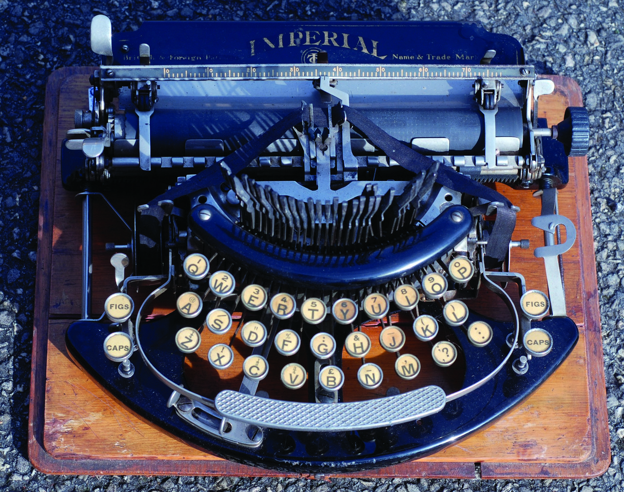 ?IMPERIAL? TYPEWRITER. 8ins tall, on wooden base, c. 1915. Curved keyboard type.  NR +