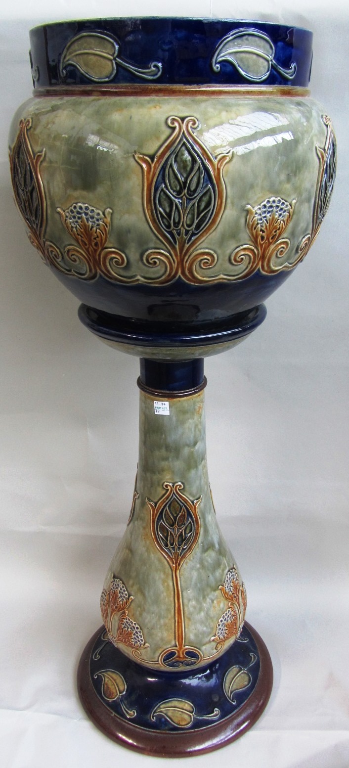 A Royal Doulton saltglaze stoneware jardiniere and stand, early 20th century, decorated with Art