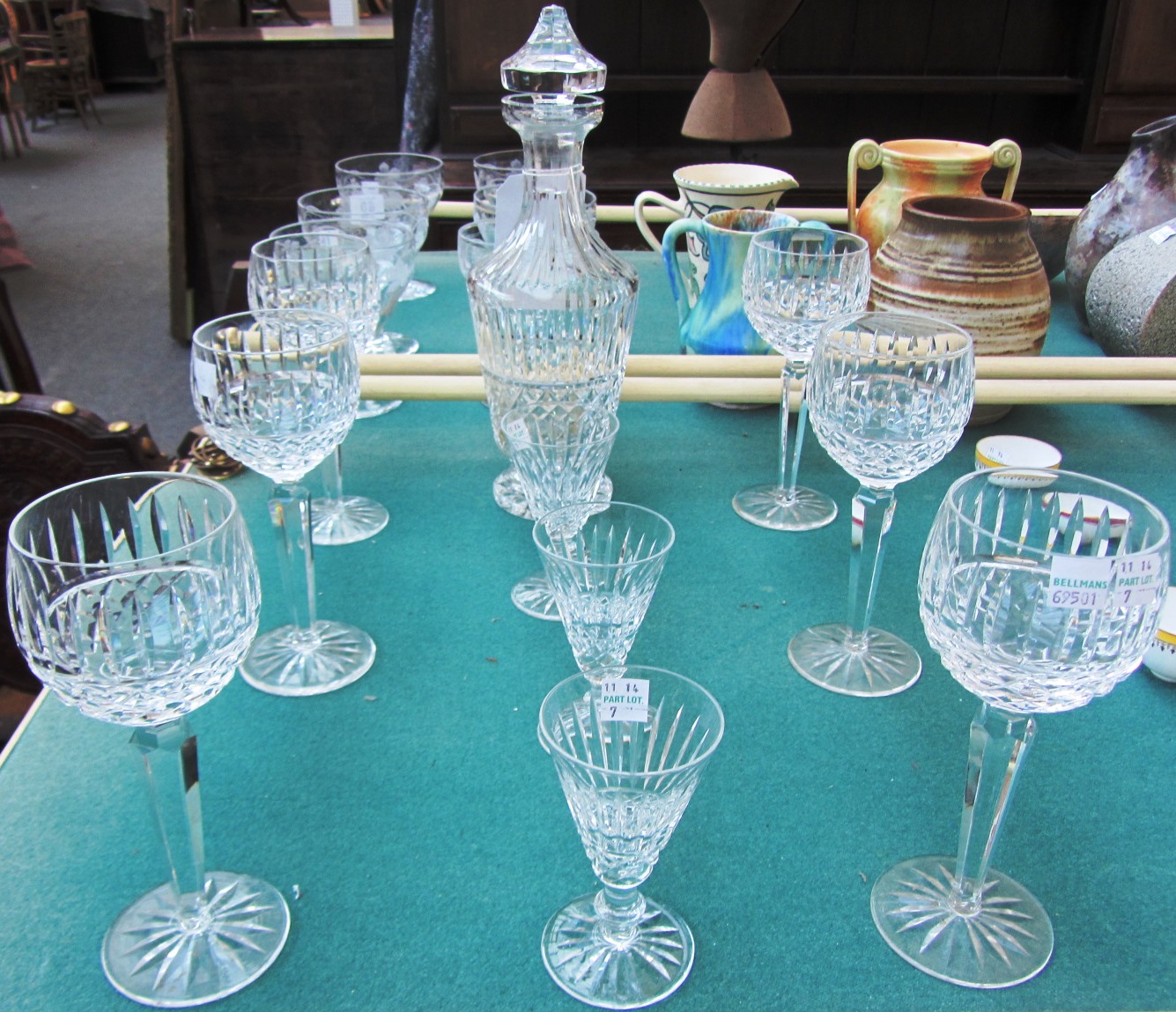 A Waterford 'Tranmore' crystal decanter and stopper, six matching hock glasses, 18.2cm high and