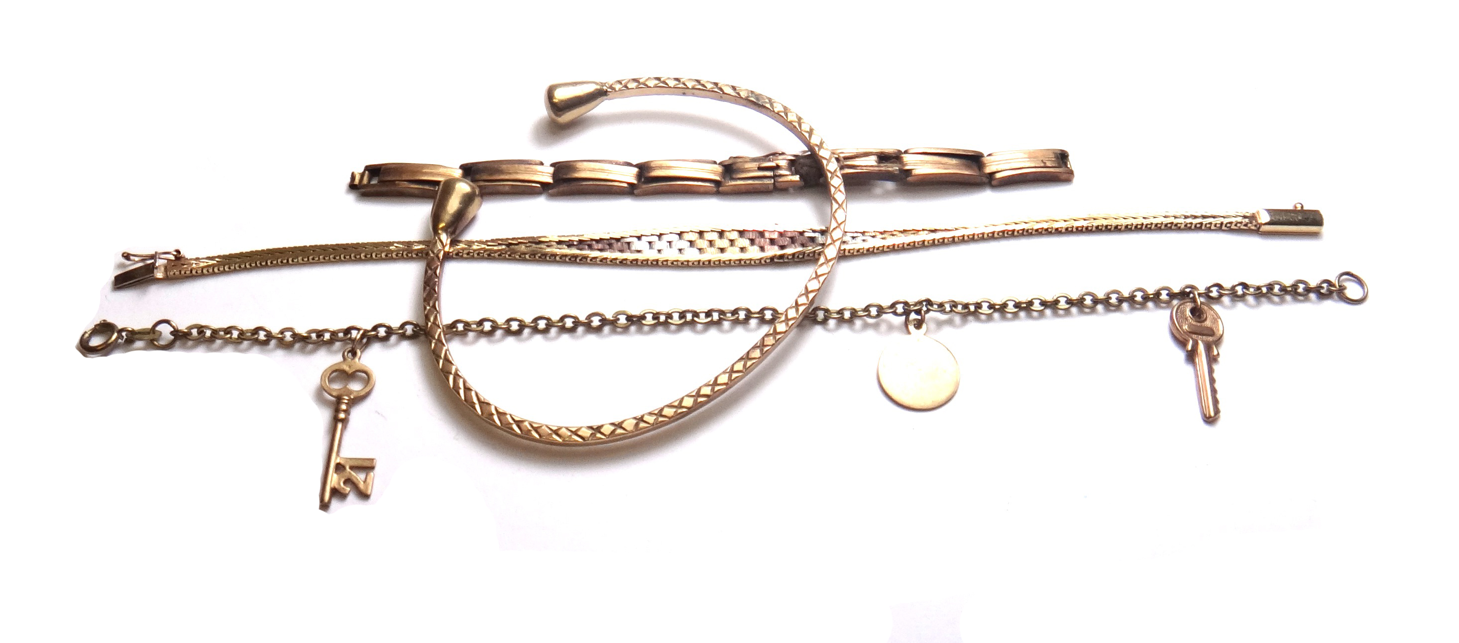 A 9ct three colour gold bracelet, in a brick link design, on a snap clasp, an oval link bracelet,