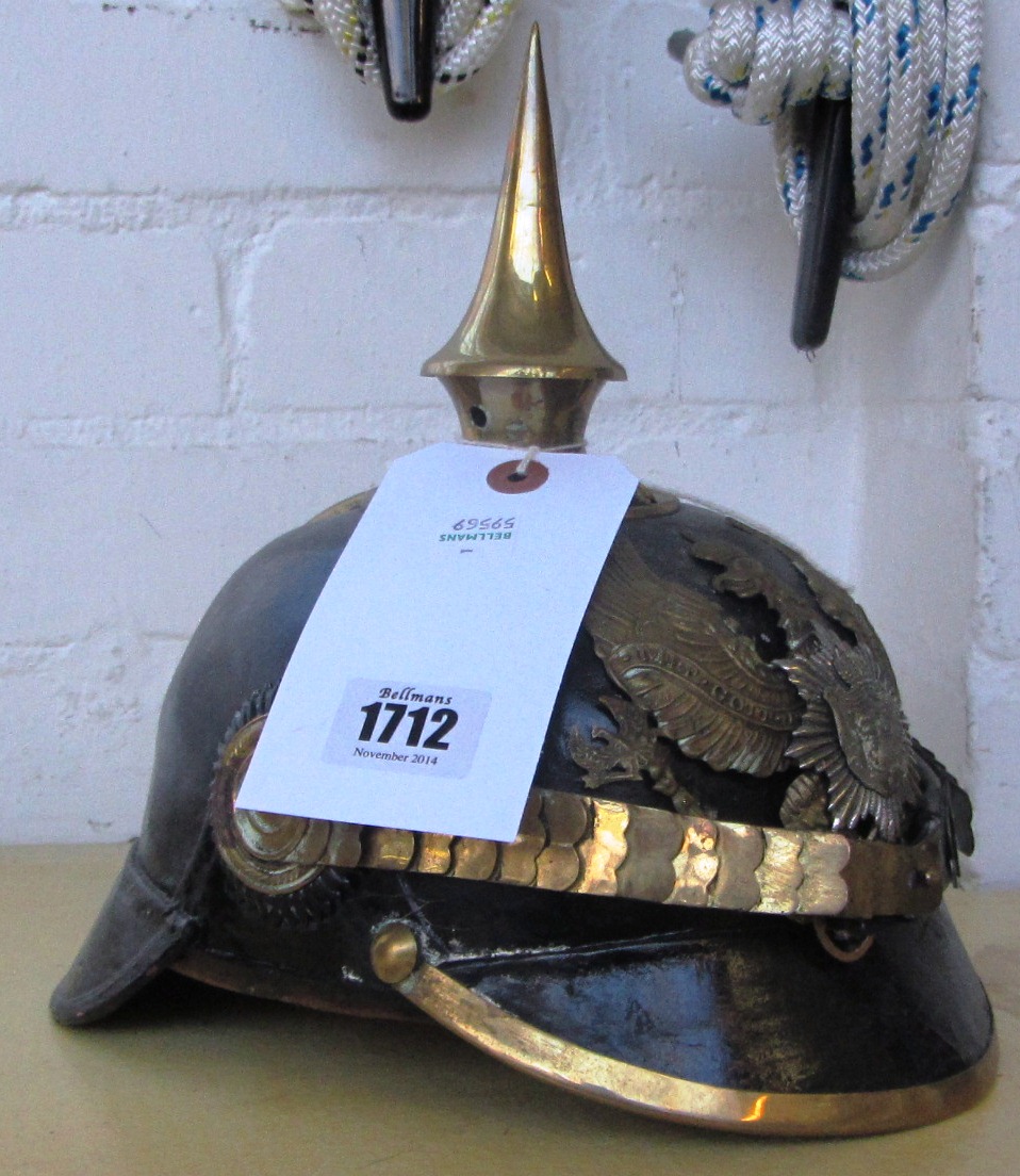 An Imperial German Pickelhaube helmet, WW1 period and later alterations, with brass helmet plate,