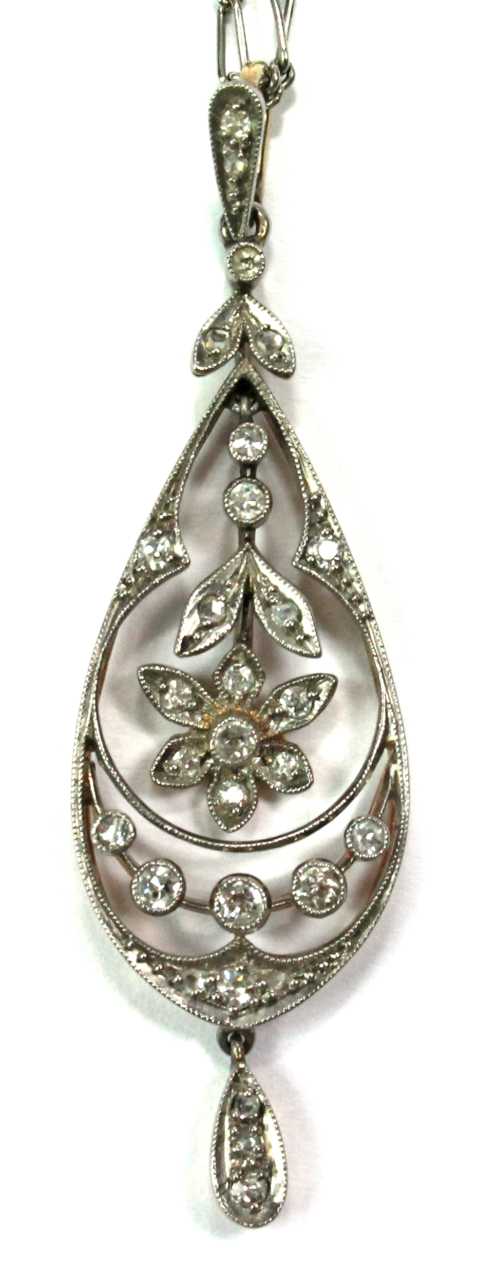 A diamond set drop shaped pendant, the centre with a pendant flowerhead motif, mounted with rose cut