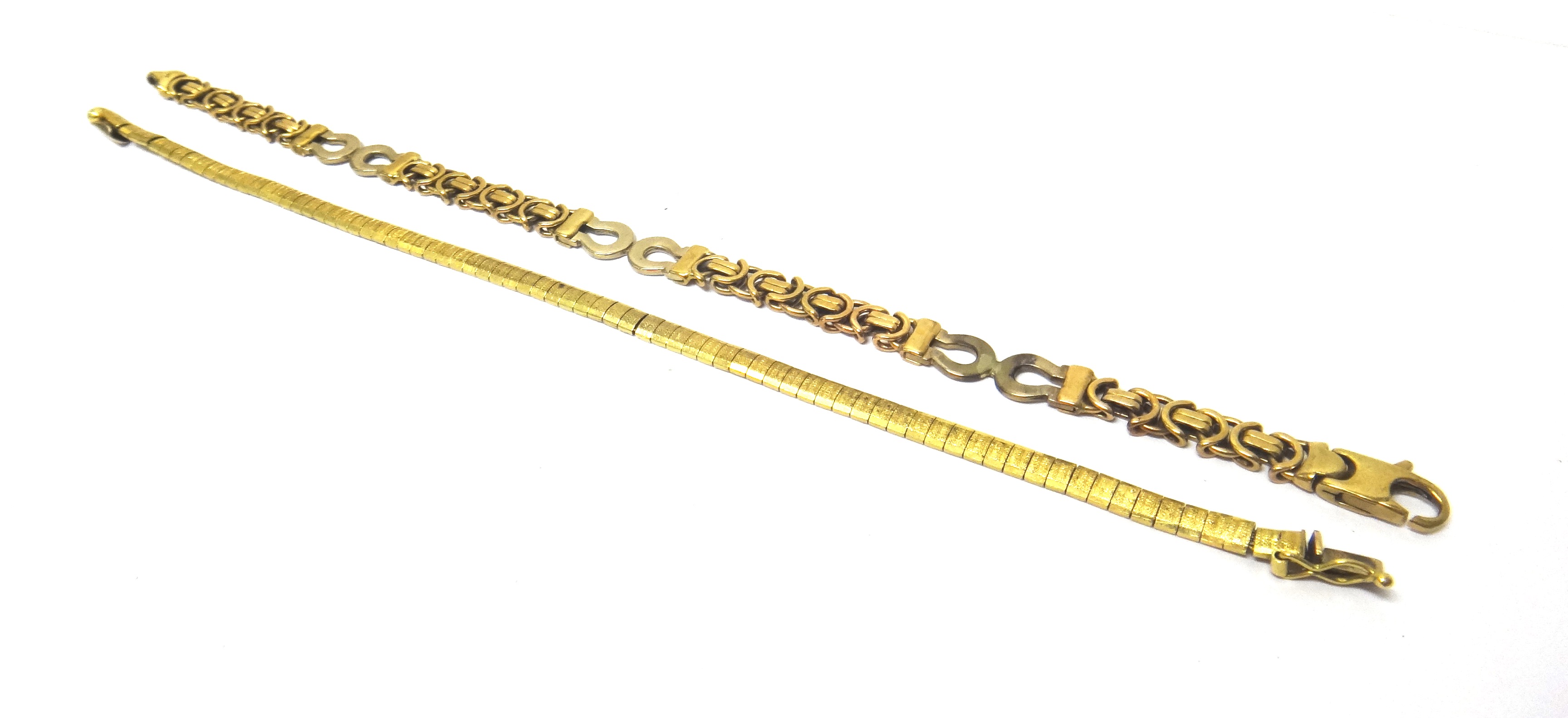 A 9ct two colour gold bracelet, in an interwoven and horseshoe shaped link design, on a sprung