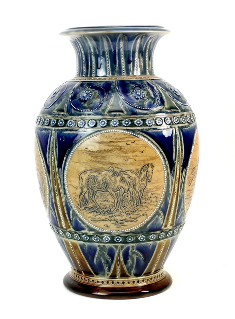 A Doulton Lambeth saltglaze stoneware vase by Hannah Barlow, dated 1875, the body decorated with