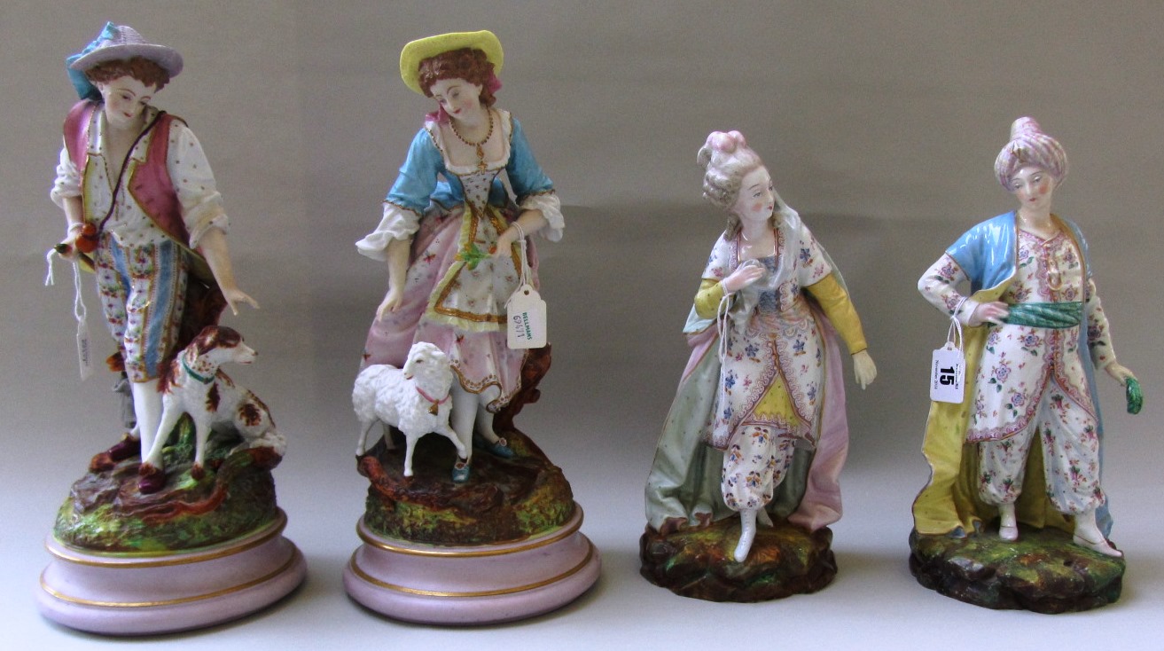 A pair of Limoges style porcelain figures, late 19th century, modelled as shepherd and