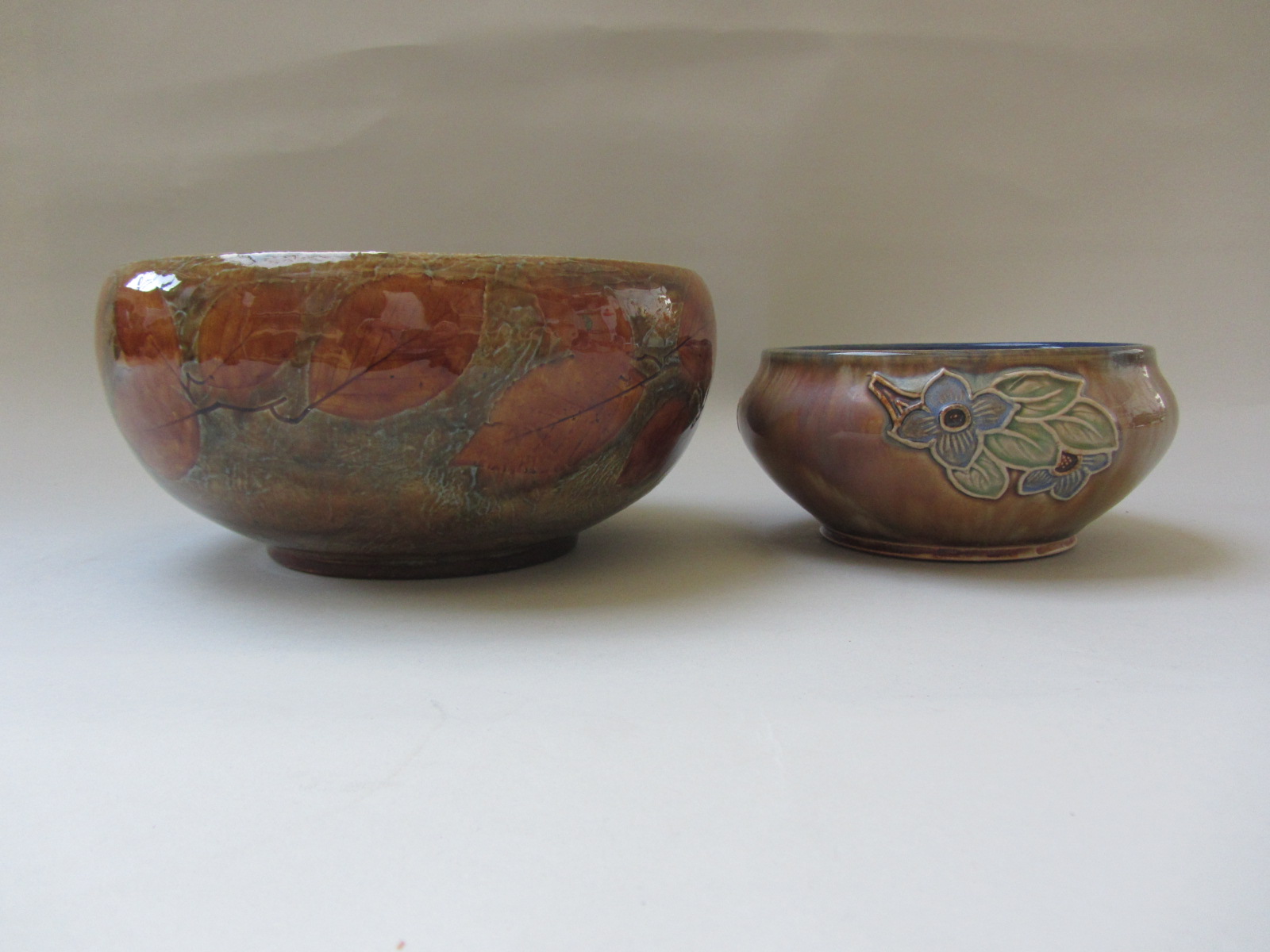 A Royal Doulton saltglaze stoneware bowl decorated in the Autumn Leaves pattern, impressed marks,