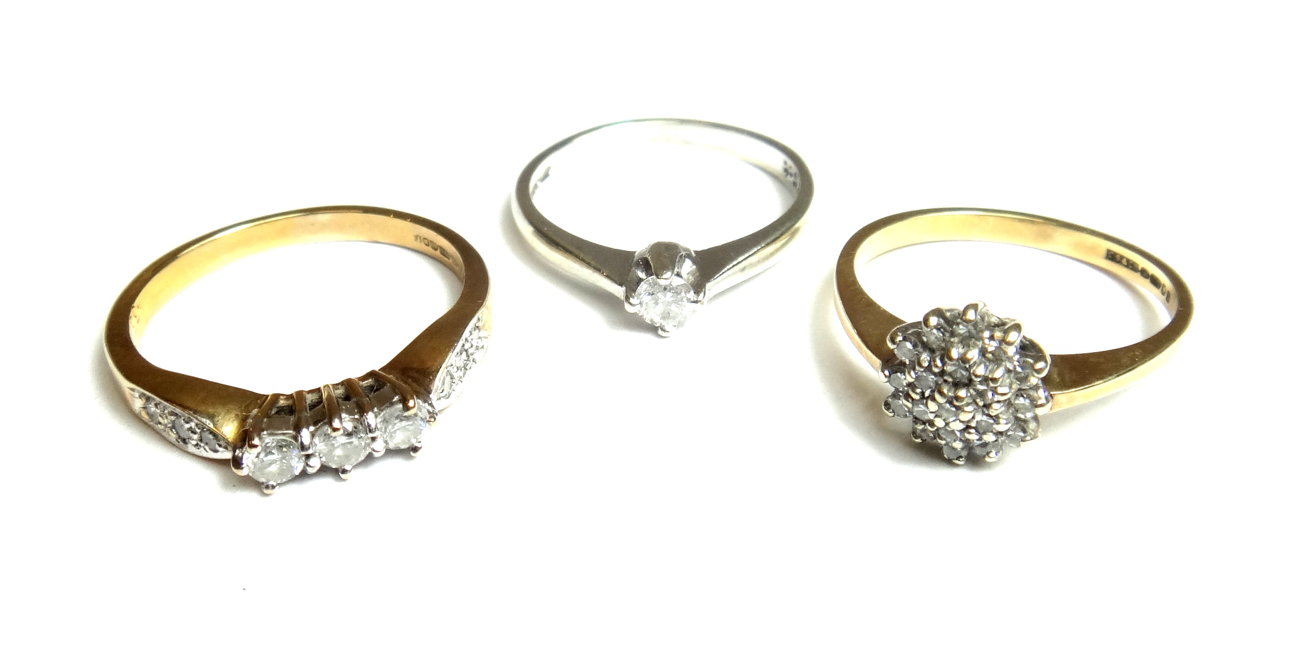 A 9ct white gold and diamond set single stone ring, claw set with a circular cut diamond, a 9ct gold