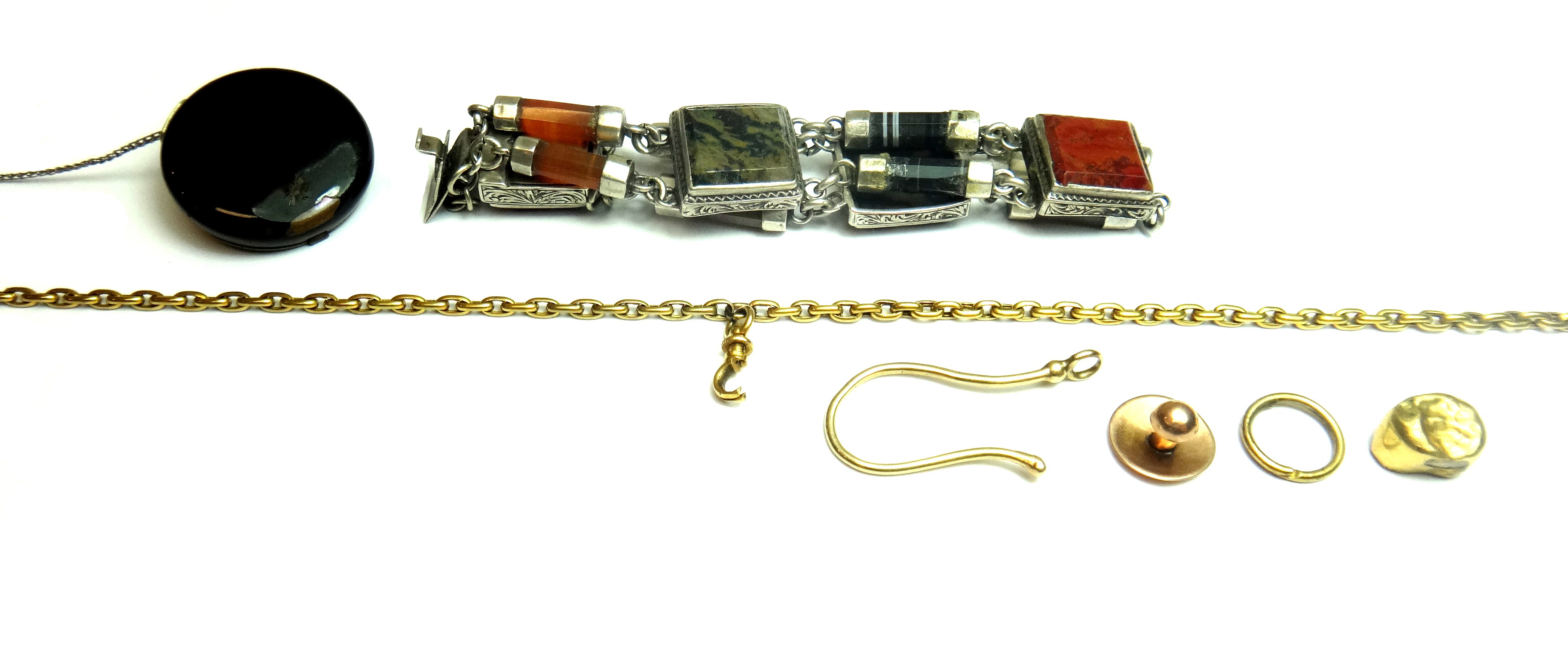 A silver mounted vary coloured agate panel and baton shaped link bracelet, on a snap clasp, fitted