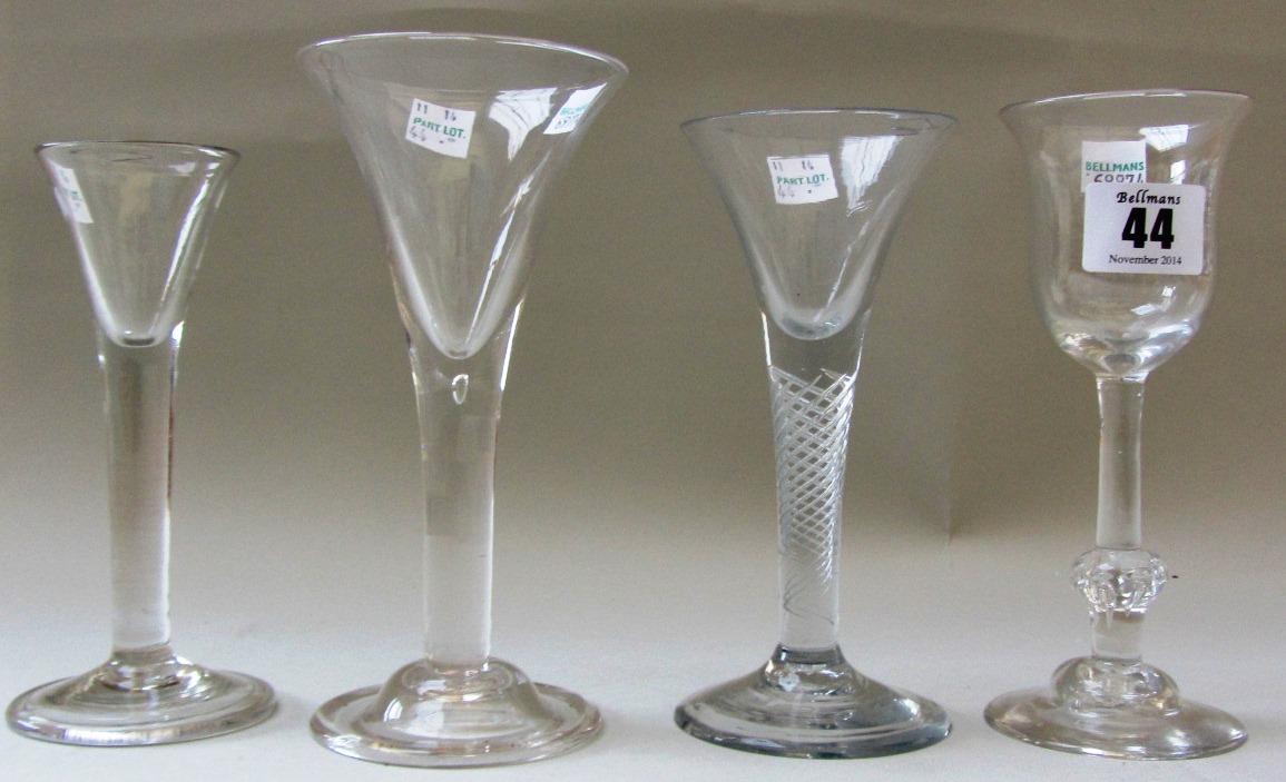 A group of four wine glasses, mid 18th century and later, comprising; a wine glass with tulip bowl