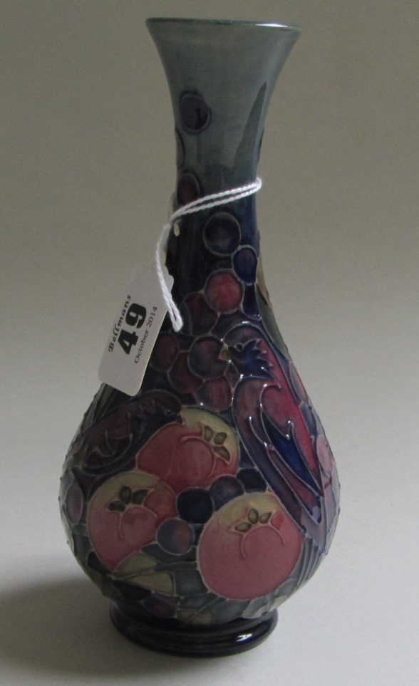 A Moorcroft pottery vase, late 20th century, decorated in the 'Finches' pattern against a blue/green