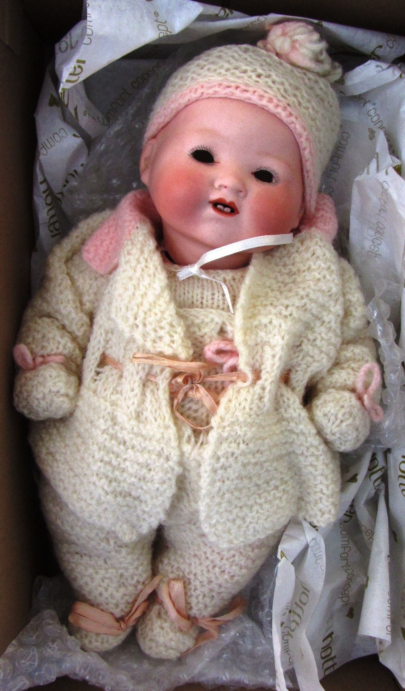 An Armand Marseille bisque head doll, early 20th century, mould no.390, with sleep eyes, open