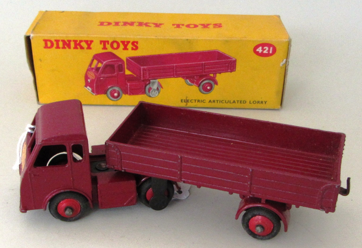 A Dinky 421 Electric Articulated lorry, maroon livery, boxed.