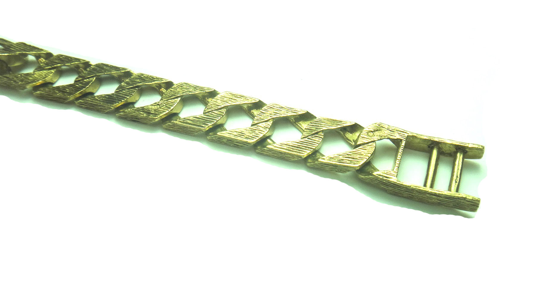 A 9ct gold bracelet, in an alternating bark textured and plain curb link design, with a foldover