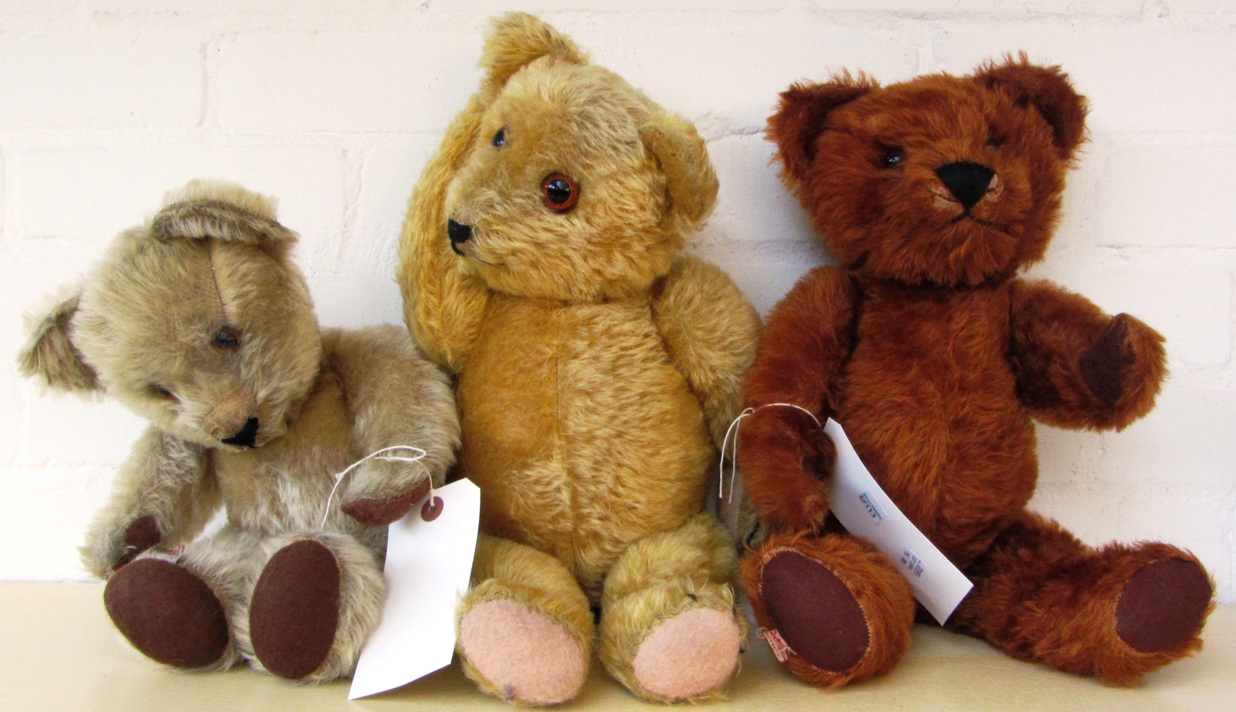 Three Tara toy teddy bears, circa 1930, all labelled Made in Eira or similar, the tallest 49cm, (