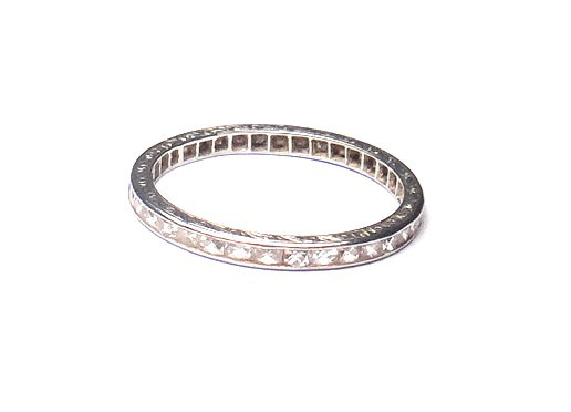 A diamond set full eternity ring, mounted with calibre cut diamonds, the sides of the mount with
