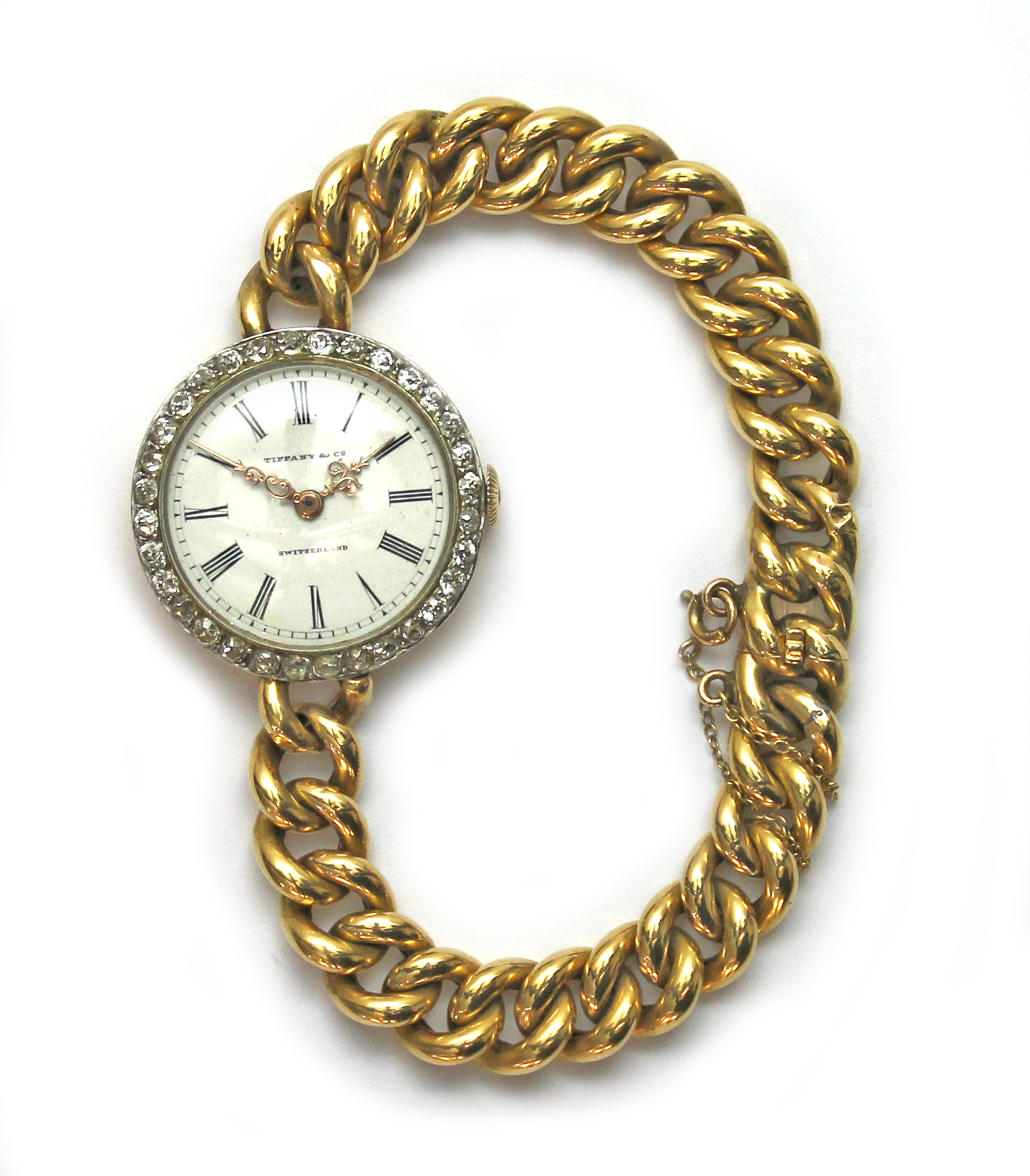 A lady's gold and diamond set Tiffany bracelet wristwatch, the jeweled lever movement detailed