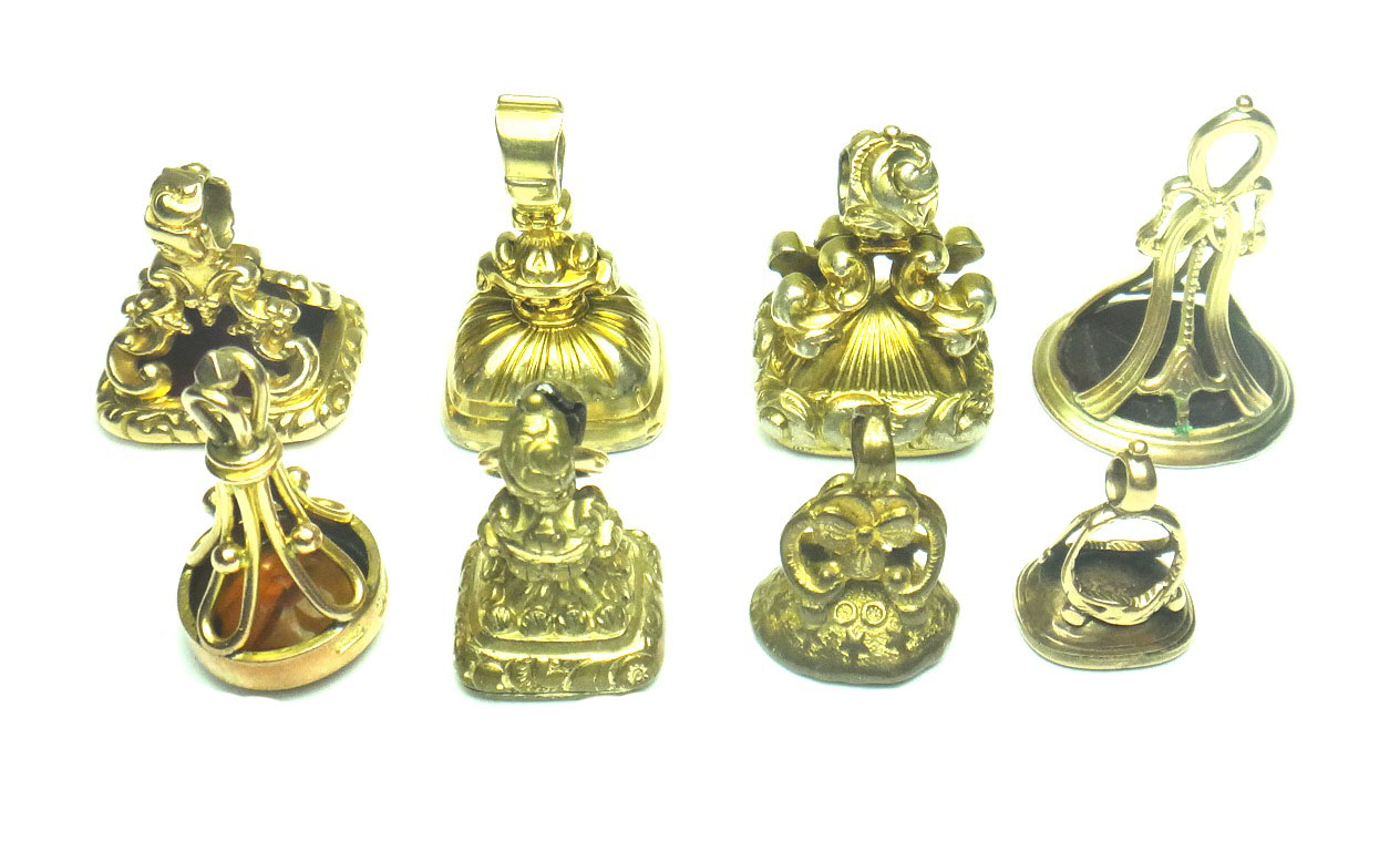 A 9ct gold and cornelian set fob seal, a 9ct gold and yellow gem set fob seal, Birmingham 1903, a