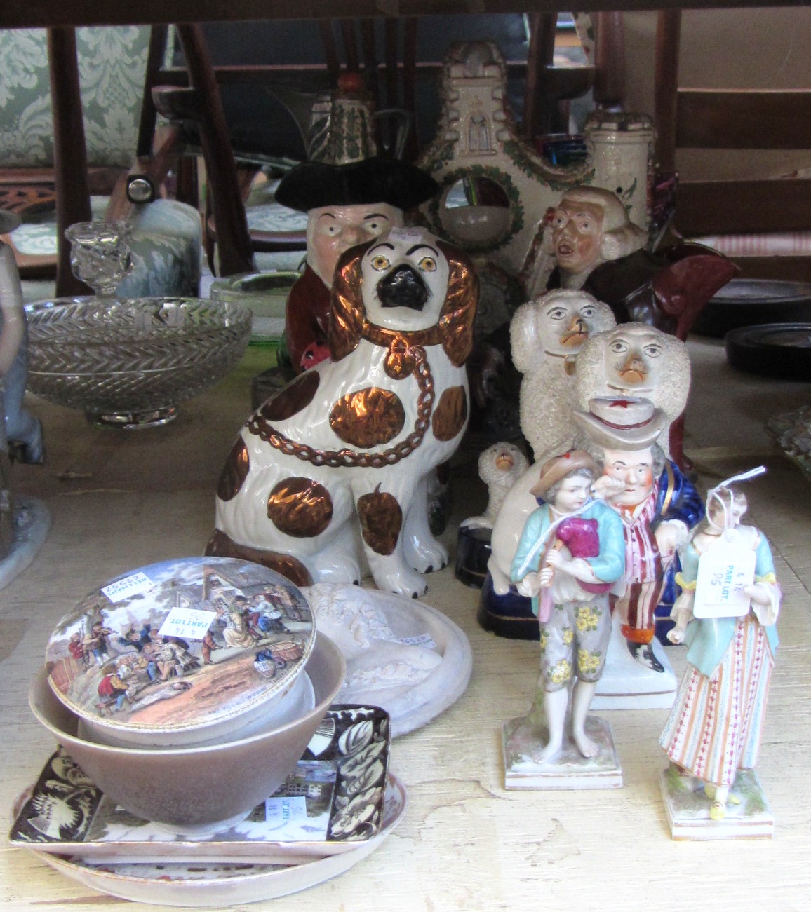 A quantity of ceramics including; two 19th century Toby jugs, a pair of Staffordshire poodle