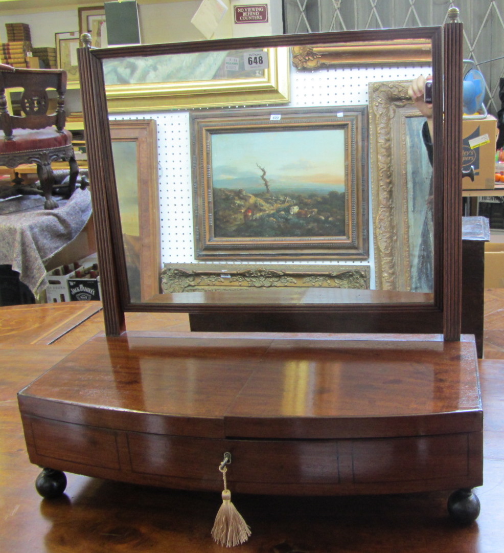 A 19th century and later mahogany toilet mirror, the bow base with lift top amboyna fitted