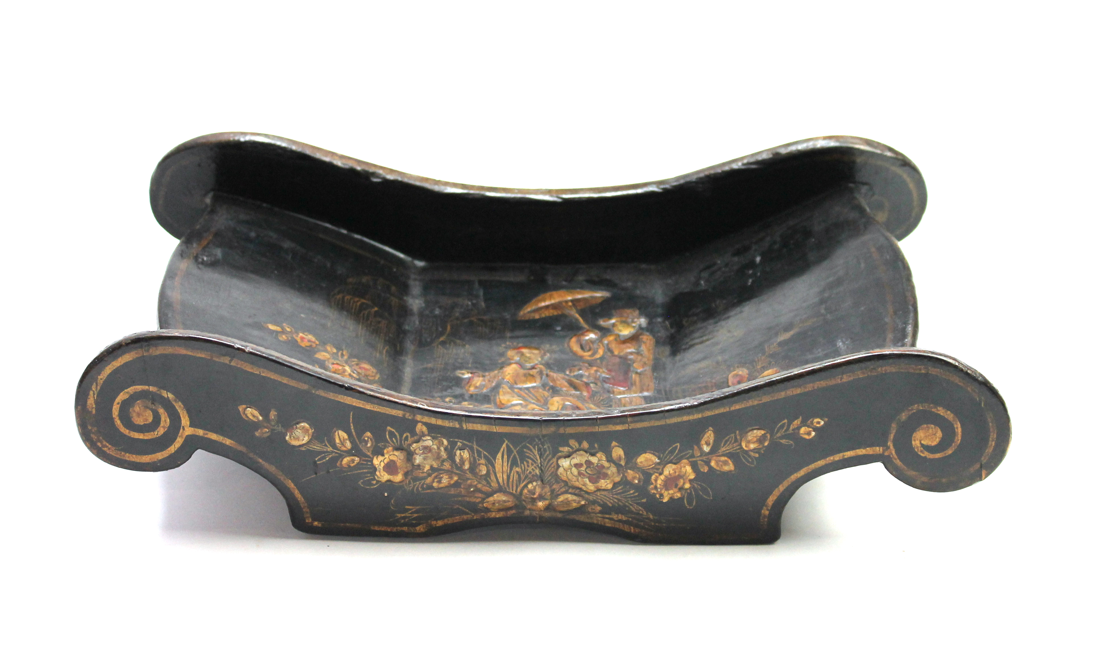 An 18th century black lacquer chinoiserie decorated cheese coaster, 37cm wide. Illustrated