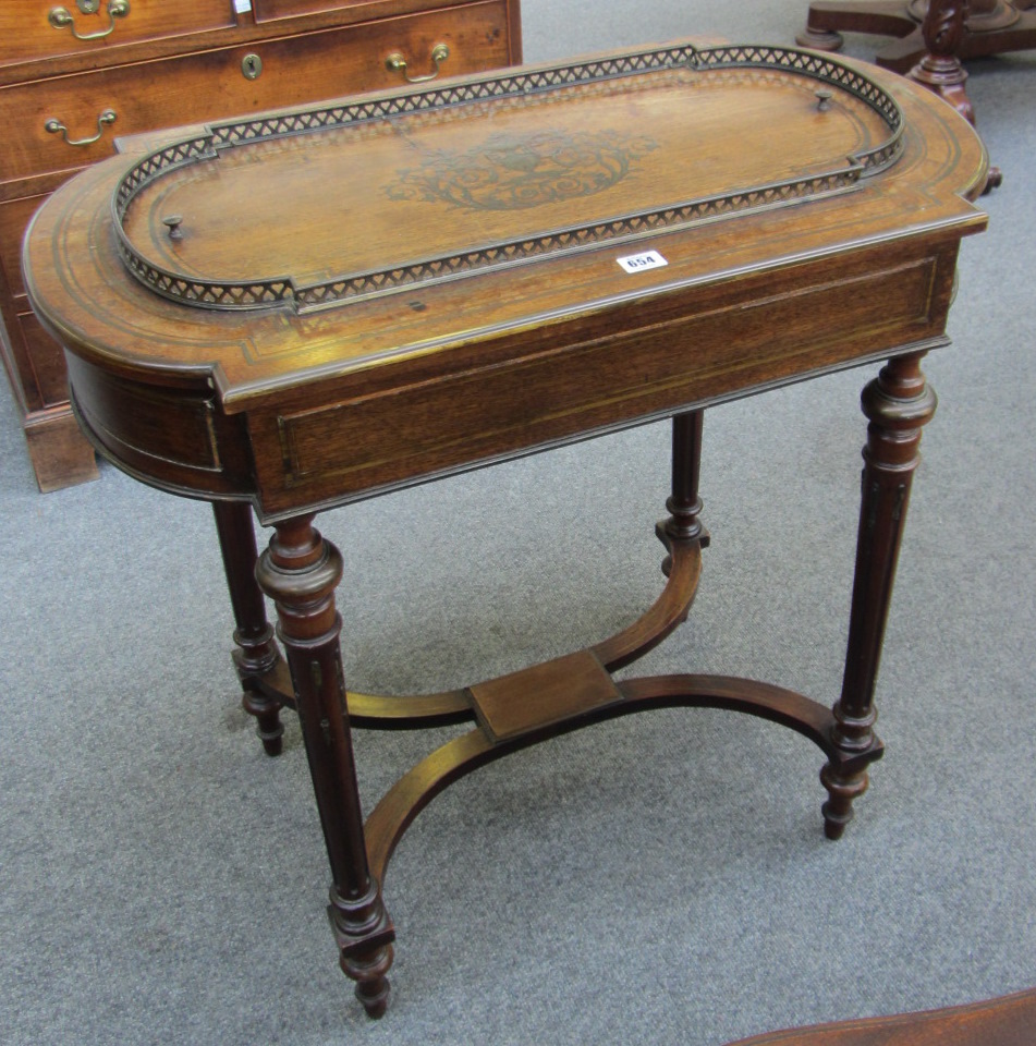 A Louis XVI style rosewood and brass inlaid jardiniere, with a pierced gallery on fluted tapering