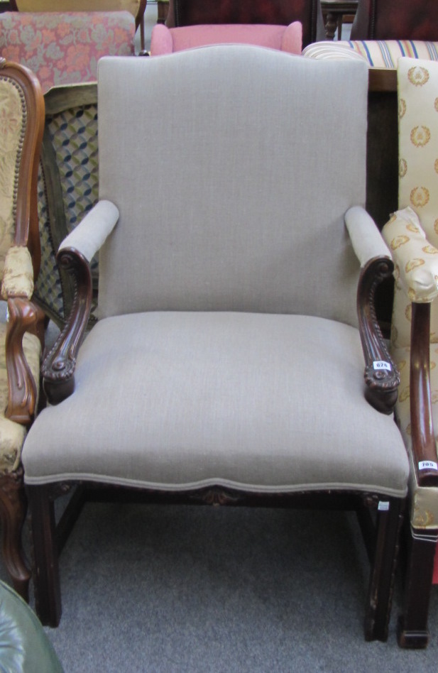 A 19th century carved mahogany framed open armchair of Gainsborough design.
