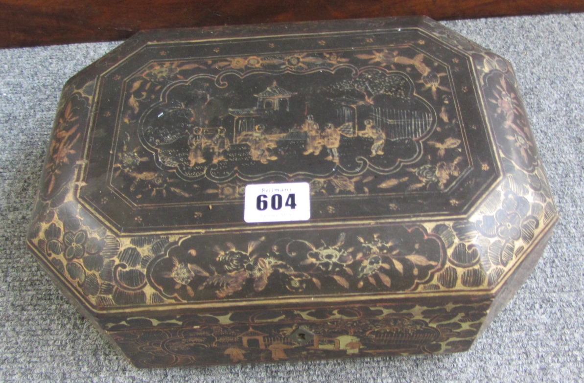 A 19th century black lacquer chinoiserie decorated sewing box of compressed octagonal form, 35cm