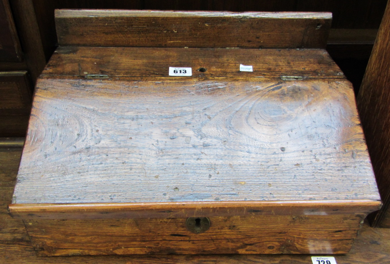 An 18th Century elm slope-front box, 43cm wide, together with a 20th century oak two door smokers