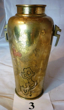 An unusual brass vase believed to be Japanese with tree and flower scenes est: £40-£60 (A2)