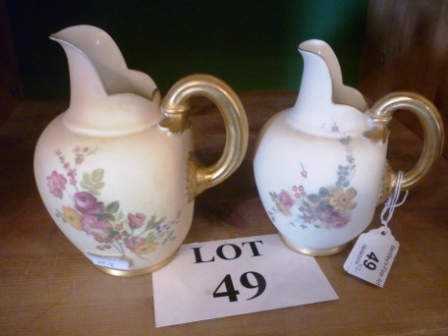 Two similar Royal Worcester blush ivory jugs painted with flowers dated 1899 and 1902 est: £40-£